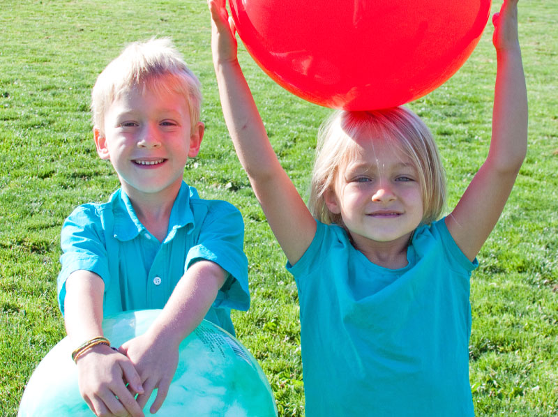 boy and girl with balls